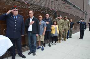 From left: Retired New York firefighter Danny Prince, retired Marine Steve Danyluk, DAV member Bobby Body and many more veterans, active-duty service members and firefighters gathered to present the Spartan Sword to the “FDNY Ten House” in New York. Held across the street from the 9/11 Memorial, the ceremony honored those who have lost their lives in sacrifice for our nation. (Photo courtesy of FDNY Photo Unit) 