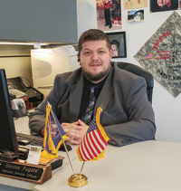 Ben Fugate sitting at desk