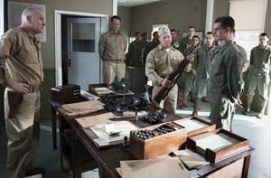 Andrew Garfield (far right) portrays conscientious objector and Medal of Honor recipient Desmond Doss, credited with carrying 75 injured soldiers one at a time down a cliff face to safety during the Battle of Okinawa. The young medic went on to rescue and render aid to several others in the days that followed, before being seriously wounded himself. (Photo by Mark Rogers © Cross Creek Pictures Pty. Ltd.)