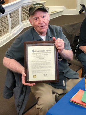 Harlan Plummer holding certificate Harlan Plummer