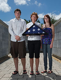 Jill Wilkins and children holding flag Jill Wilkins and Children