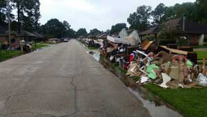 Destroyed possessions line the streets in the aftermath of flooding in Baton Rouge, La.