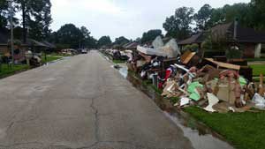 Destroyed possessions line the streets in the aftermath of flooding in Baton Rouge, La.