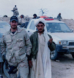 green beret and afghan man standing Mike McElhiney and Afghan man