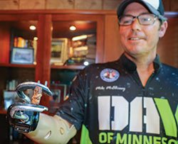 Mike McElhiney holding shrapnel Mike McElhiney