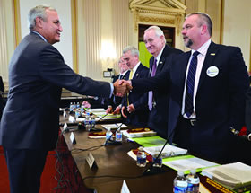House Veterans’ Affairs Committee Chairman Jeff Miller, R-Fla., left, welcomes National Adjutant Marc Burgess, right, and National Commander Joseph W. Johnston to DAV’s legislative presentation.