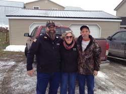 Smart-Ricker Chapter 10 2nd Jr. Vice Commander Denis Madore (left) and Smart-Ricker Auxiliary Unit 10 Adjutant Diana Gehring (center) welcome veteran Jason Voisine to his new home.