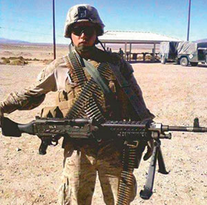 man standing in uniform with gun Lafe Cotton photo