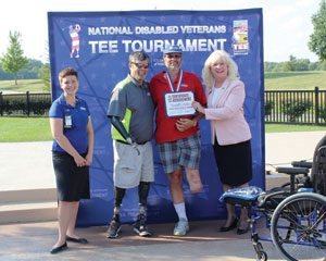 DAV National Commander Dave Riley (second from left) presents Department of Iowa Commander Randall Leshers his participant medal at the TEE Tournament. Since 1994, veterans have pushed past their personal boundaries at the event, and DAV is joining the VA as a co-host in 2017. 