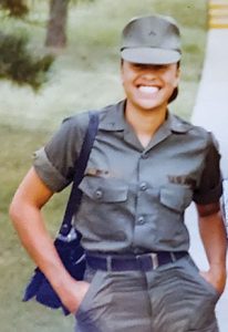 Tori Joyner standing in military